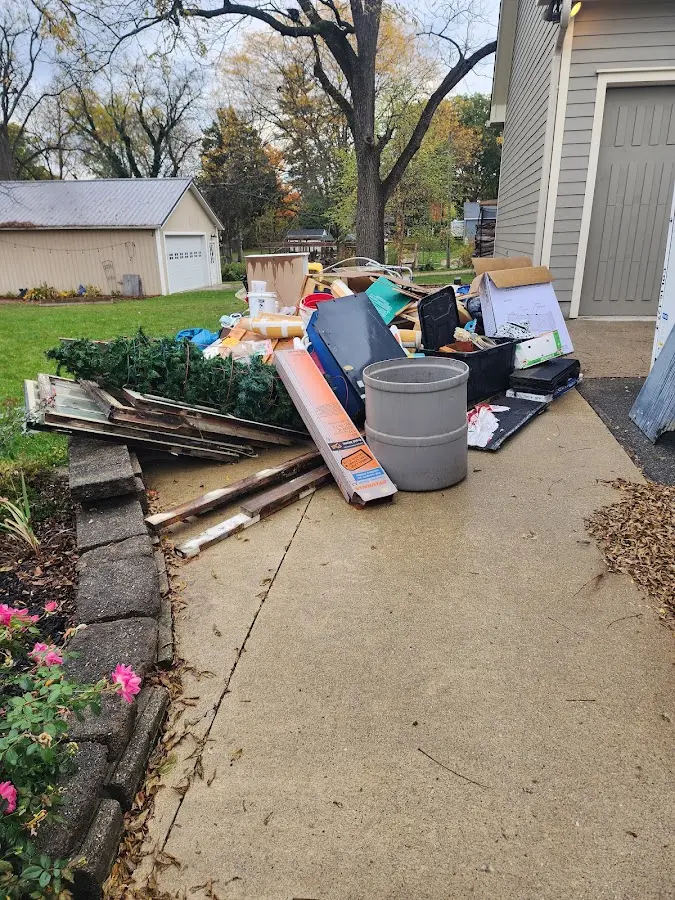 Dumpster being loaded with debris for Residential Dumpster Rental in North Ridgeville